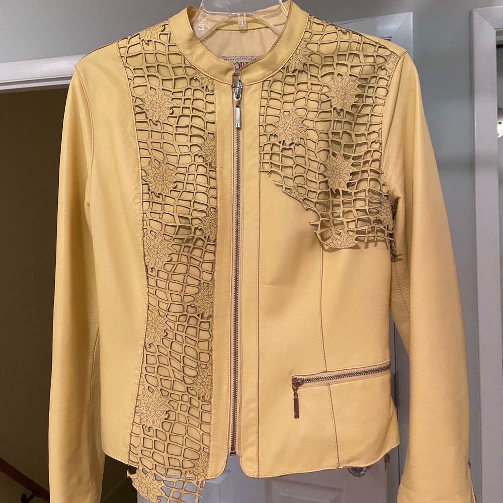 Leather jacket with cut out leather design.
